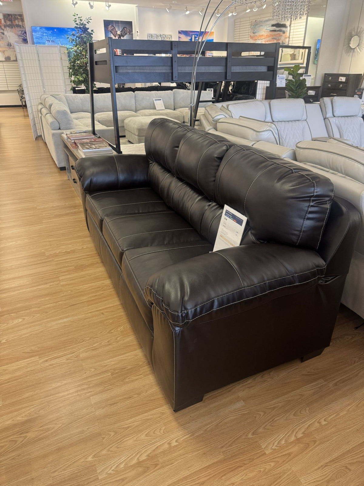 Brown faux leather sleeper sofa side view