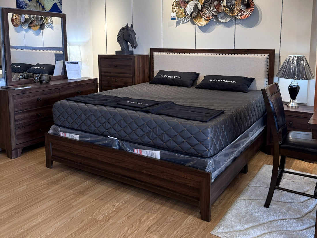 Bedroom set with upholstered headboard in the Palacio Furniture showroom